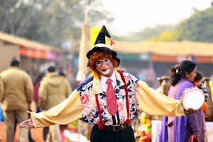 A clown joyfully entertains people