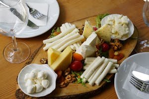 A delicious assortment of cheeses, nuts, and fruits artistically