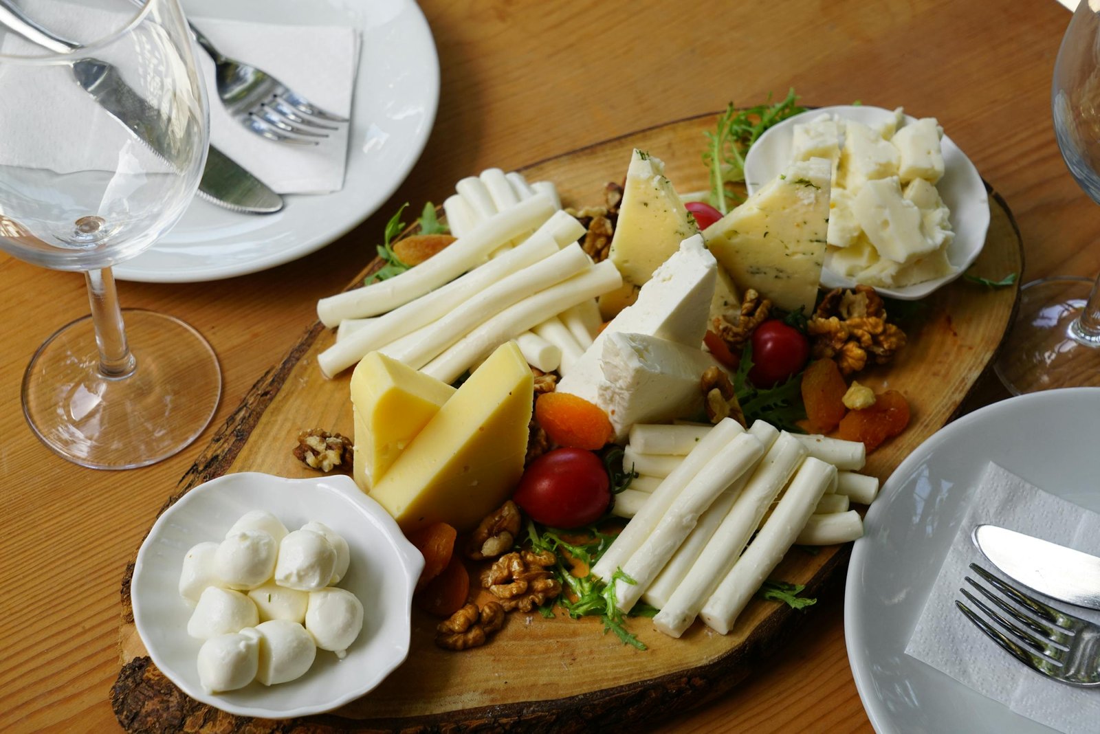 A delicious assortment of cheeses, nuts, and fruits artistically