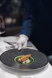 Sophisticated dessert served at a fine dining restaurant, featuring elegant plating and refined presentation.