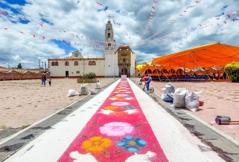 Vibrant sand carpet leading to a church